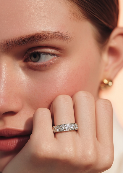 Close up of a lady wearing an 18ct diamond ring set with seven diamonds 