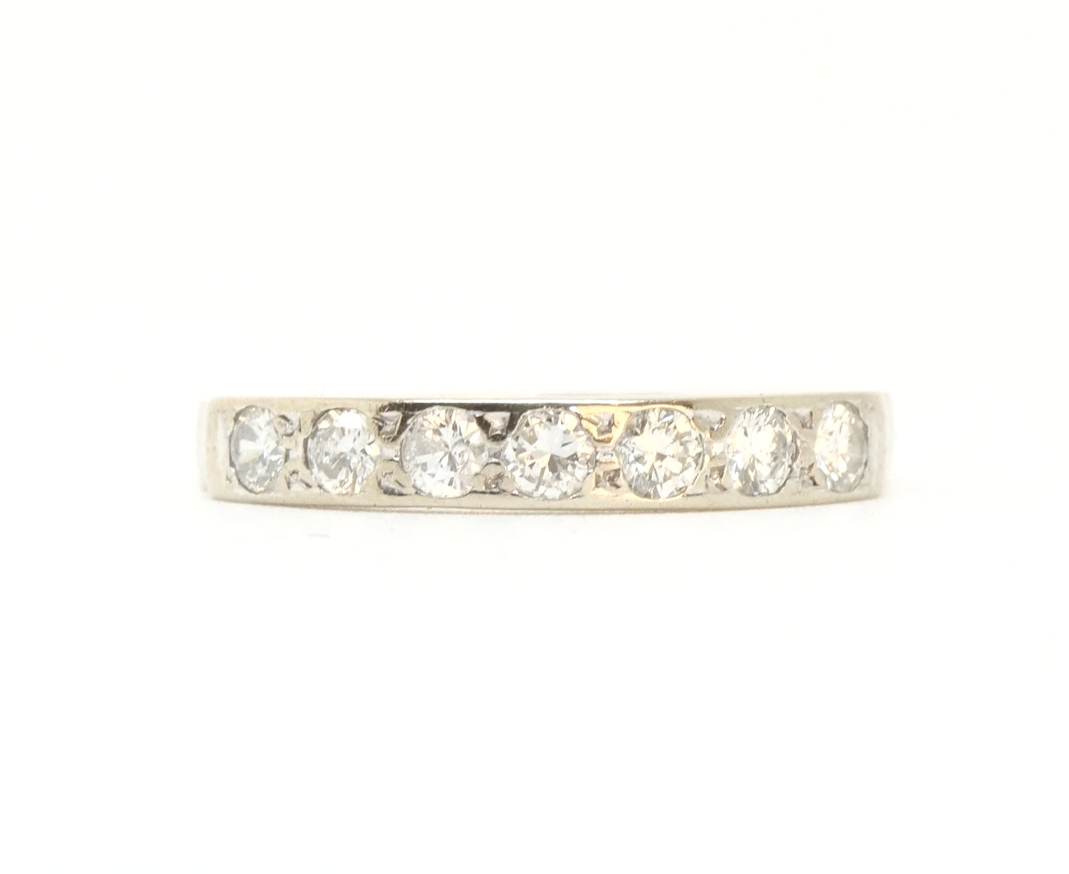 A vintage 18ct white gold diamond half eternity ring from 1975