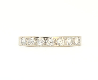 A vintage 18ct white gold diamond half eternity ring from 1975