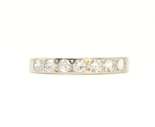 A vintage 18ct white gold diamond half eternity ring from 1975
