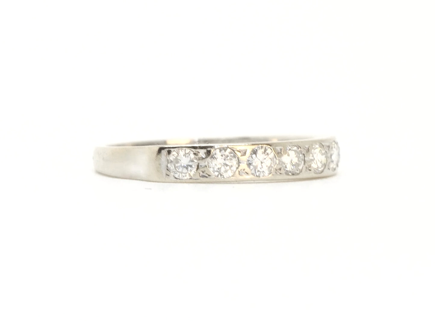 A vintage 18ct white gold diamond half eternity ring from 1975