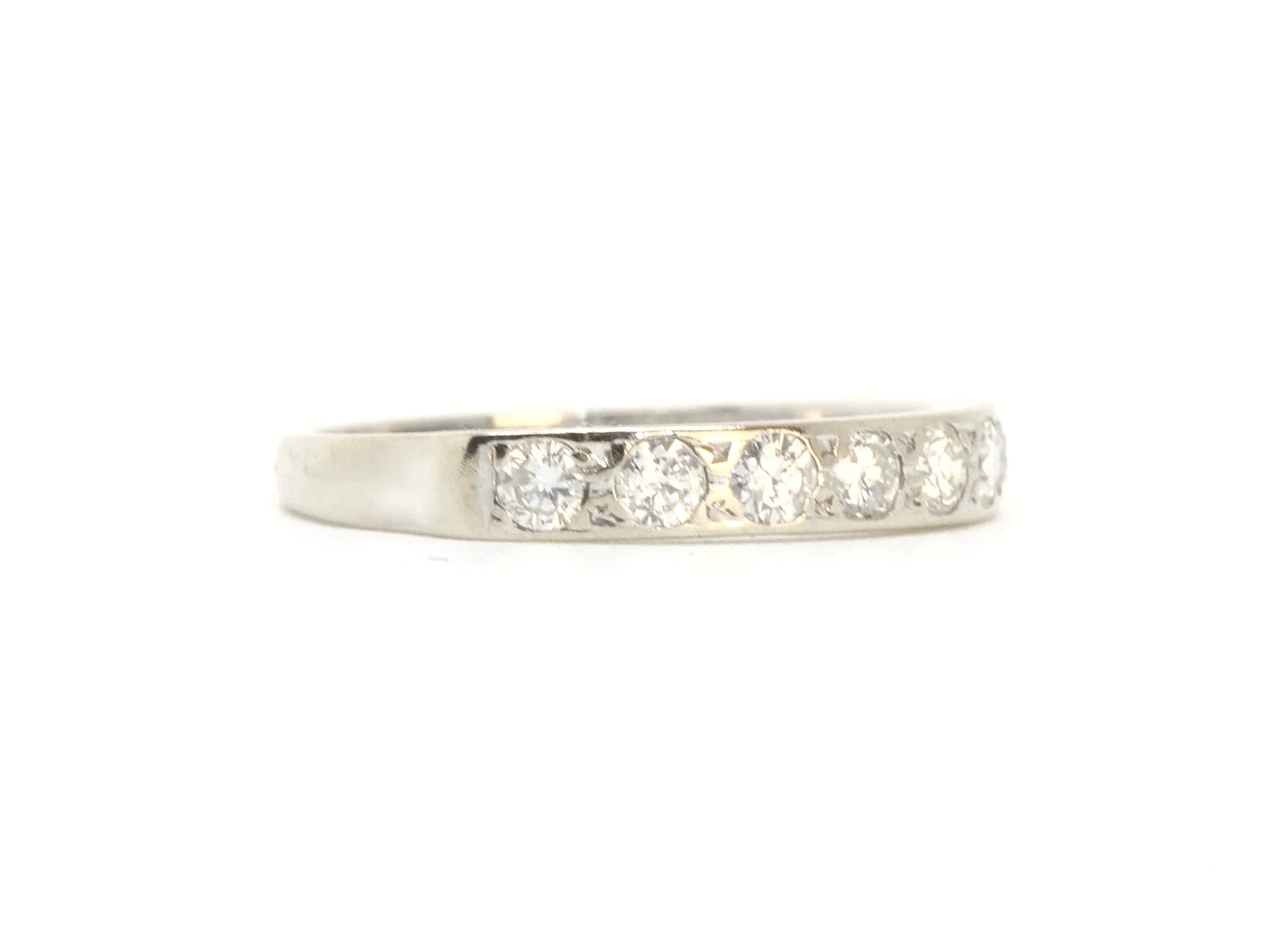 A vintage 18ct white gold diamond half eternity ring from 1975