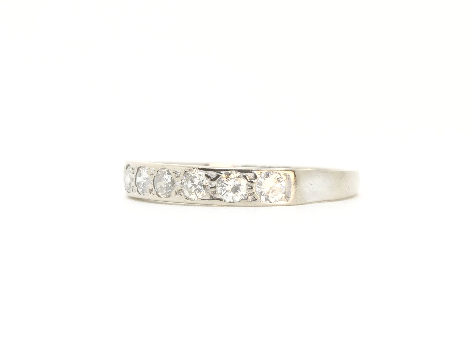 A vintage 18ct white gold diamond half eternity ring from 1975