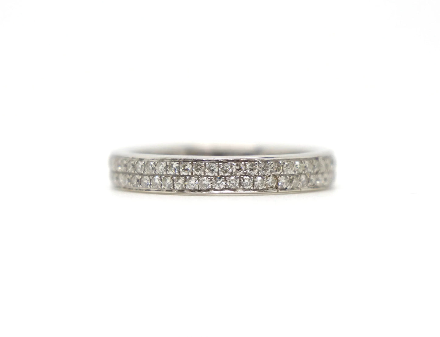 A platinum full eternity ring set with two continuous rows of round brilliant cut diamonds