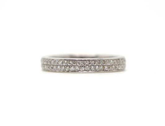 A platinum full eternity ring set with two continuous rows of round brilliant cut diamonds
