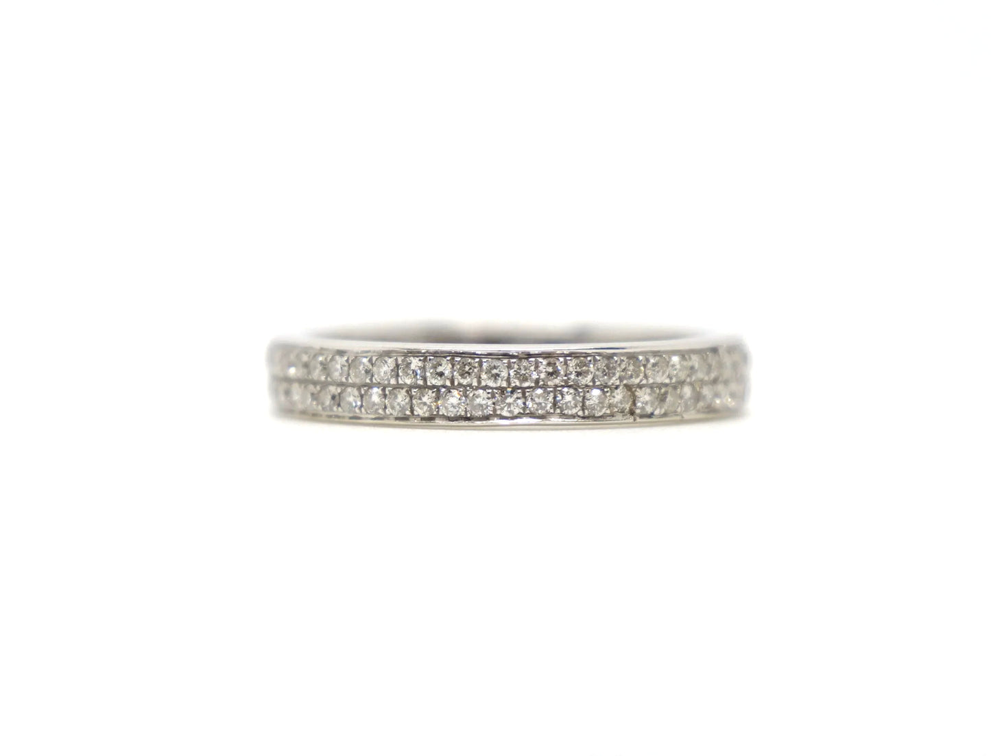 A platinum full eternity ring set with two continuous rows of round brilliant cut diamonds