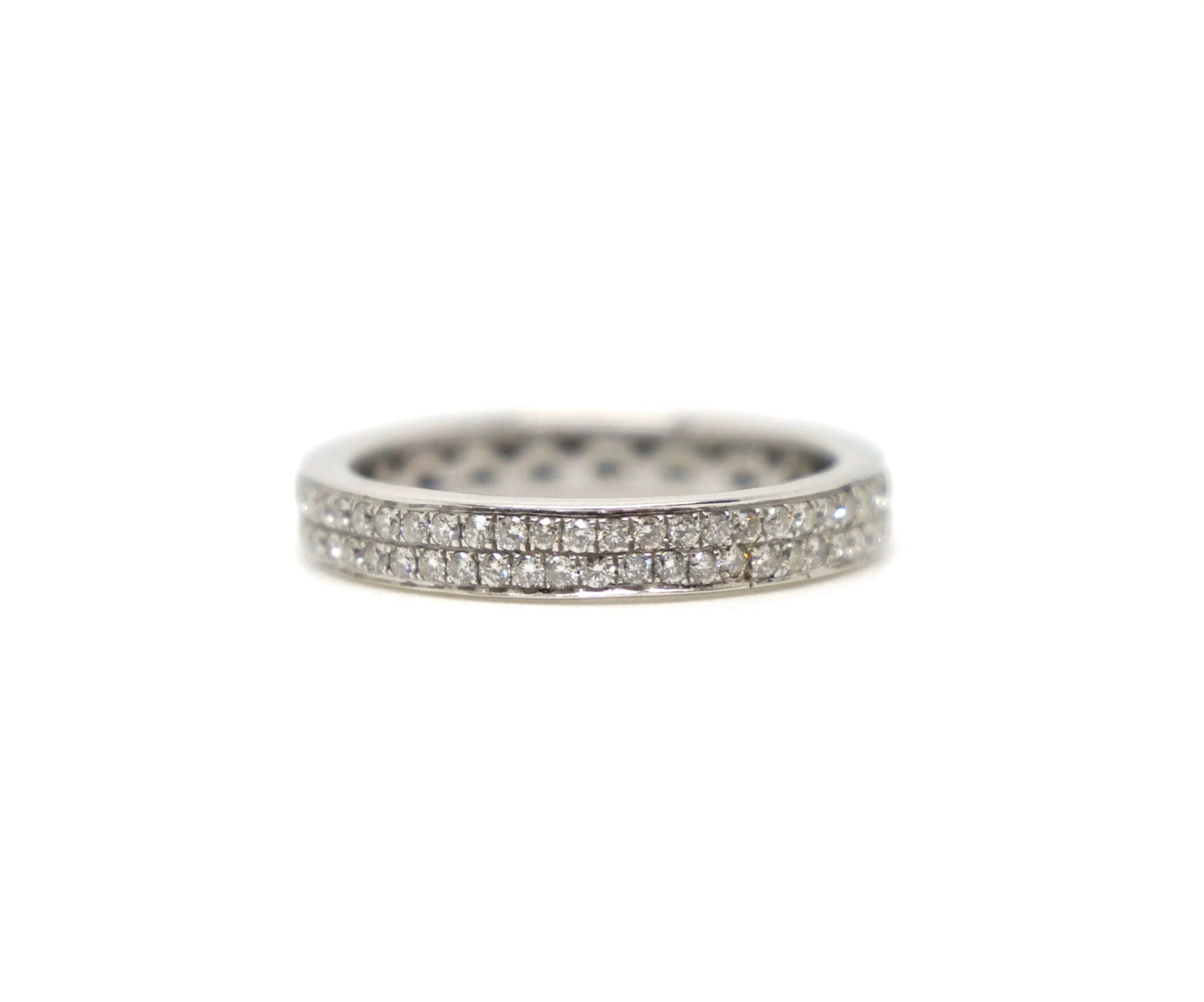 A platinum full eternity ring set with two continuous rows of round brilliant cut diamonds