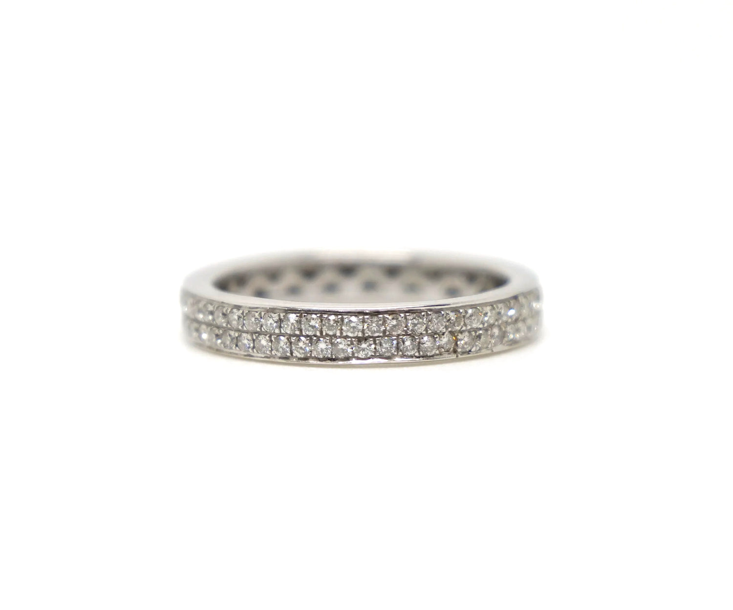 A platinum full eternity ring set with two continuous rows of round brilliant cut diamonds