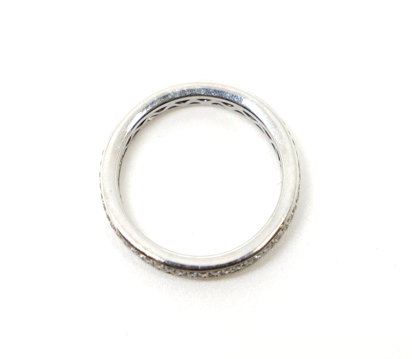 A platinum full eternity ring set with two continuous rows of round brilliant cut diamonds