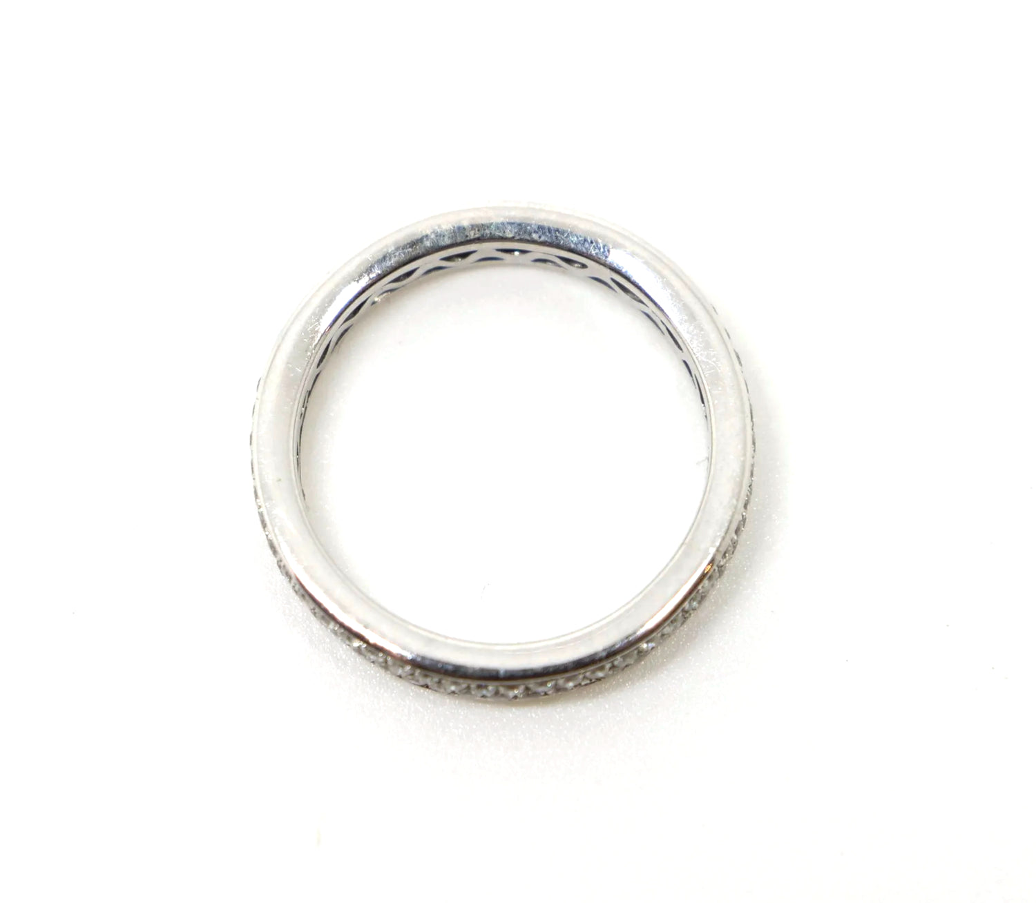 A platinum full eternity ring set with two continuous rows of round brilliant cut diamonds