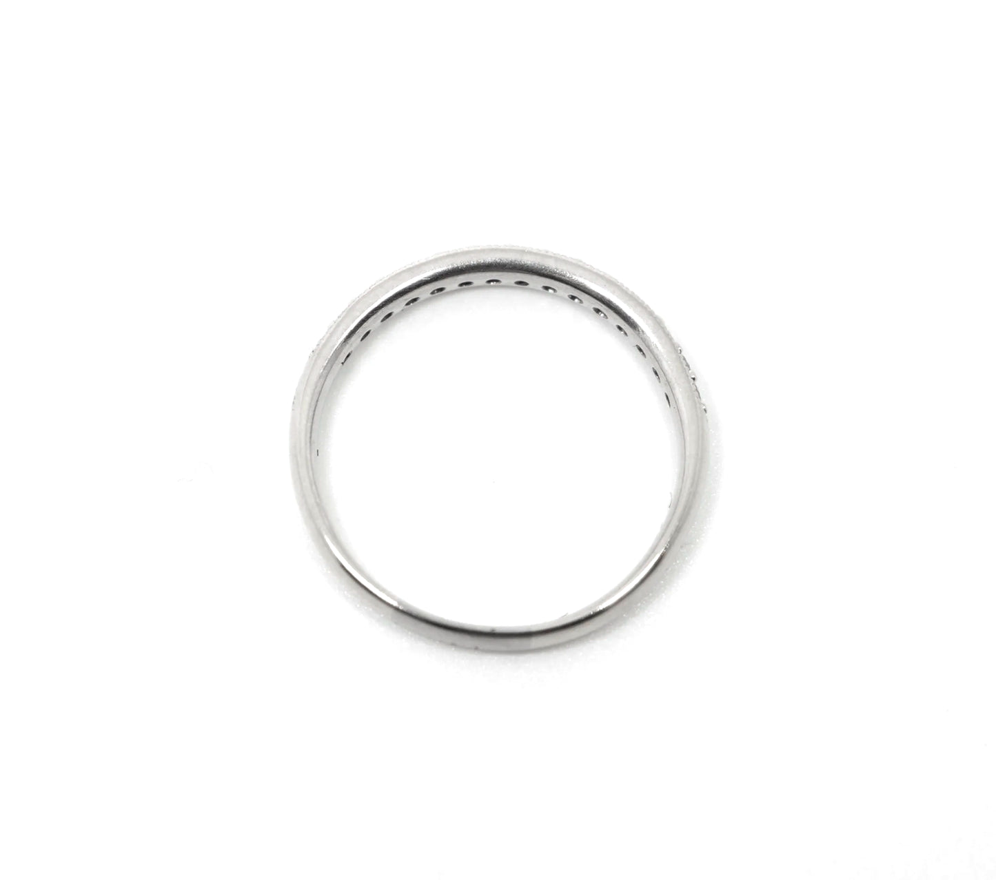 18ct white gold diamond half eternity ring, set with round brilliant cut diamonds across the top half of the band and edged with fine milgrain detail along both sides